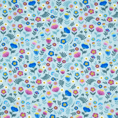 Ditsy flowers are printed on a sky blue cotton jersey fabric