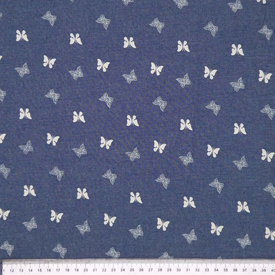 Mini butterflies printed on a cotton chambray fabric with a cm ruler