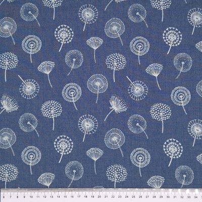 Dandelions printed on a denim chambray fabric with a cm ruler