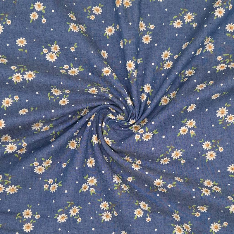 Ditsy daisies printed on a cotton denim chambray fabric