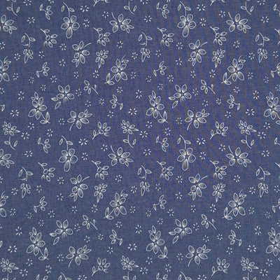 Ditsy flowers printed on a cotton denim chambray fabric