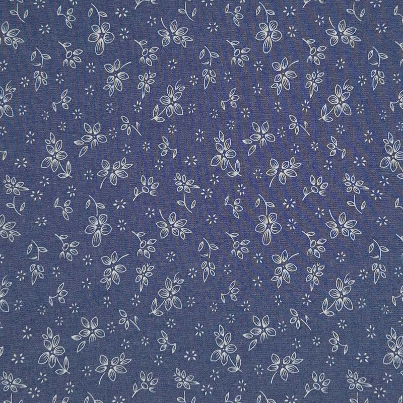 Ditsy flowers printed on a cotton denim chambray fabric