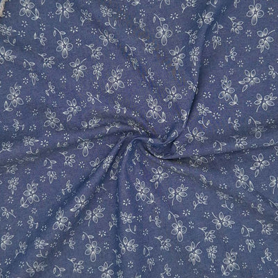 Ditsy flowers printed on a cotton denim chambray fabric