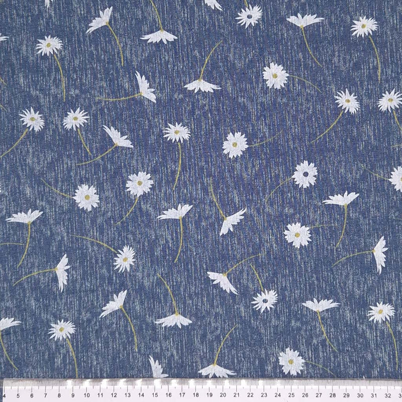 Daisies printed on a chambray fabric with a cm ruler