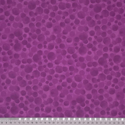 Multi-sized dots printed on a berry purple 100% cotton with a cm ruler