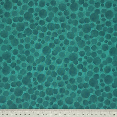 Multi-sized dots printed on a hampshire green 100% cotton with a cm ruler