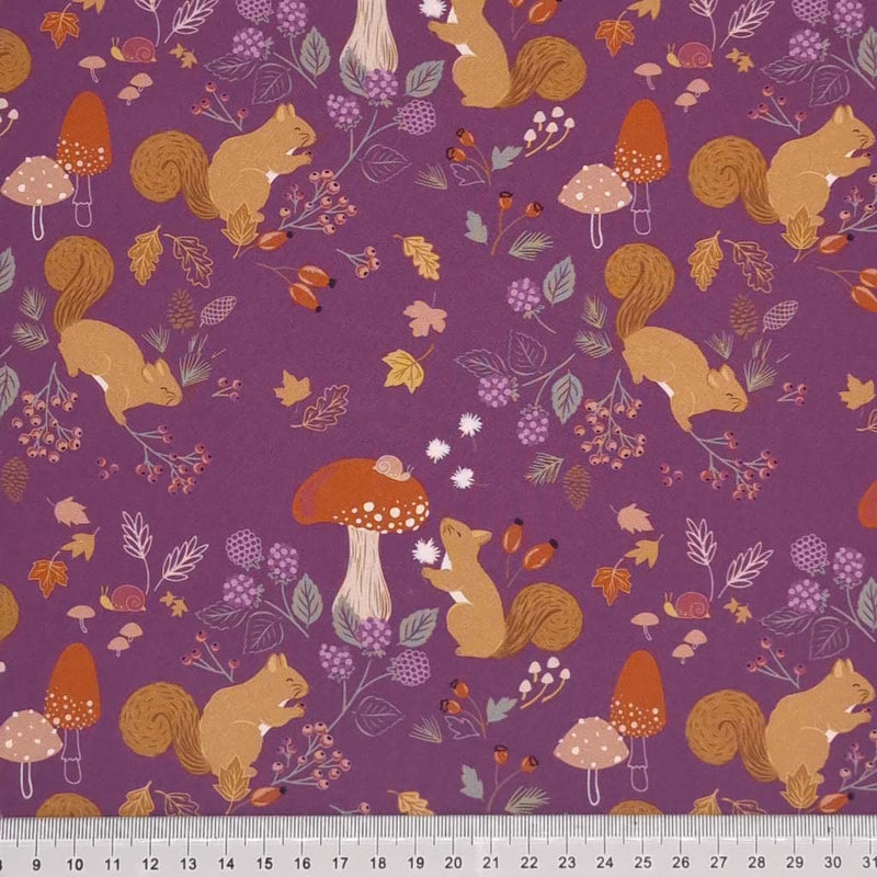 Squirrels printed on a purple cotton fabric