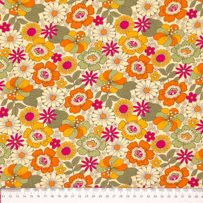 A retro floral design printed on a cream cotton jersey fabric with a cm ruler