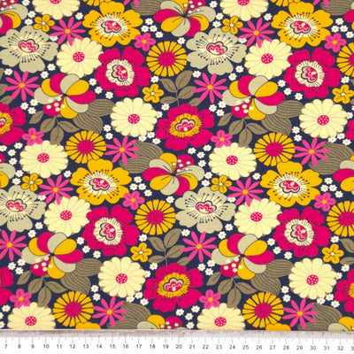 A retro floral design printed on a navy cotton jersey fabric with a cm ruler