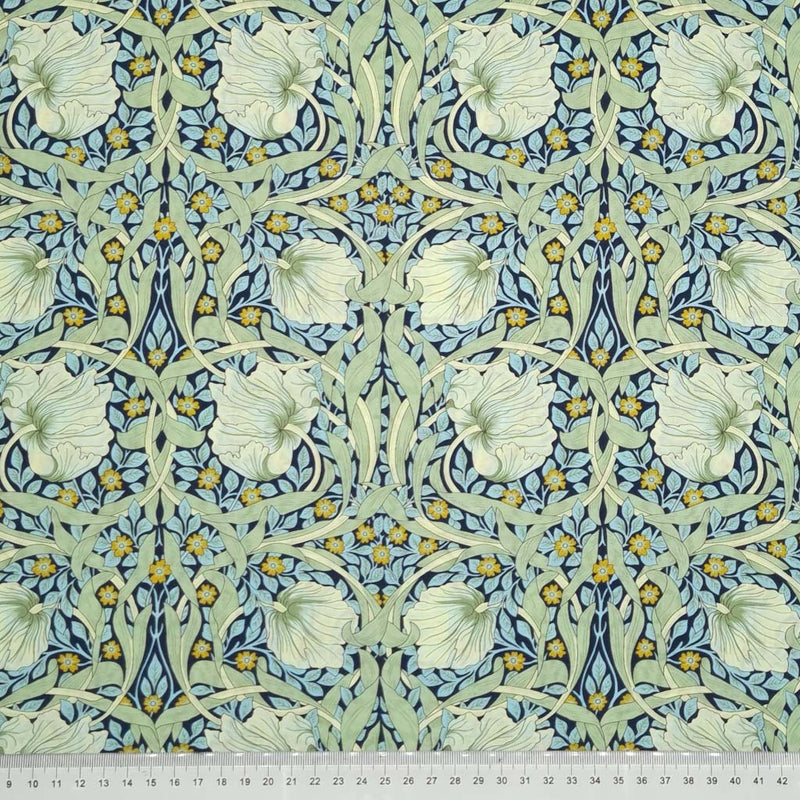 William Morris Pimpernel in navy and green printed on a pima cotton lawn with a cm ruler