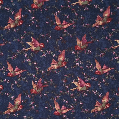 Birds are printed on a navy cotton lawn fabric