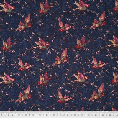 Birds are printed on a navy cotton lawn fabric with a cm ruler