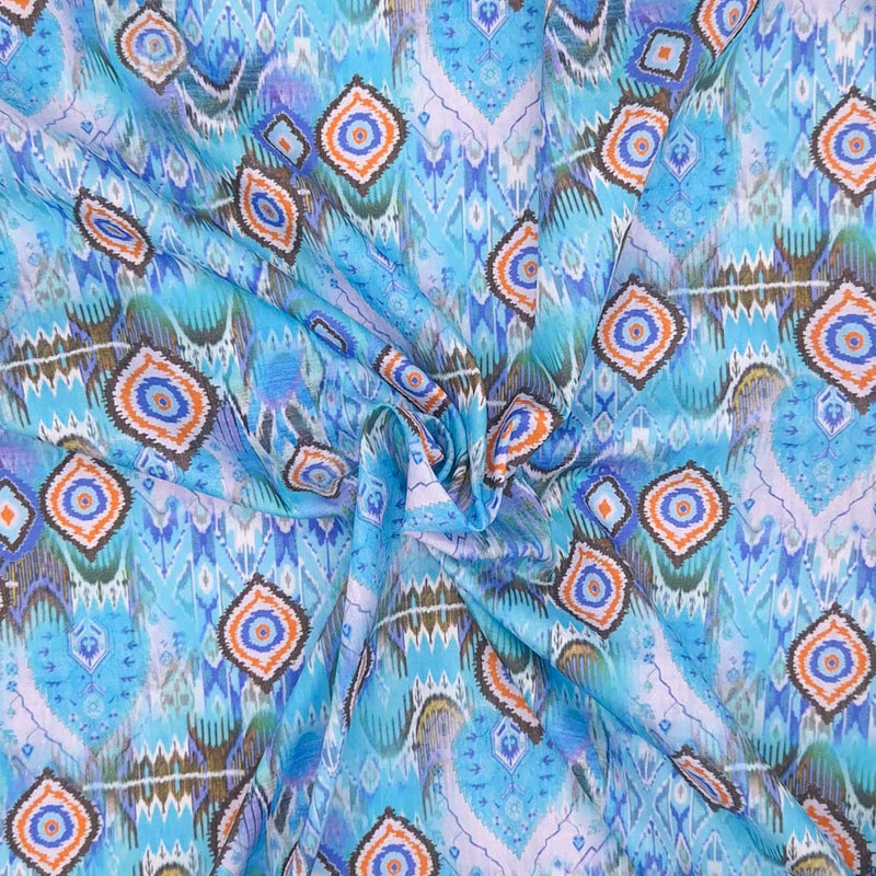 Aqua batik design printed on a cotton poplin for dressmaking
