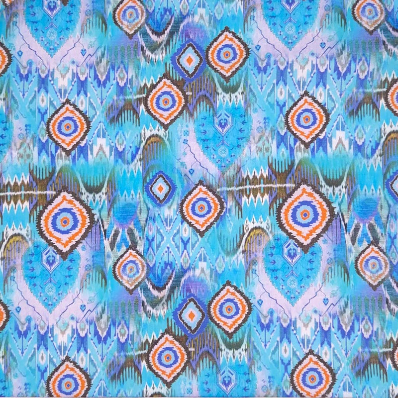 Aqua batik design printed on a cotton poplin for dressmaking