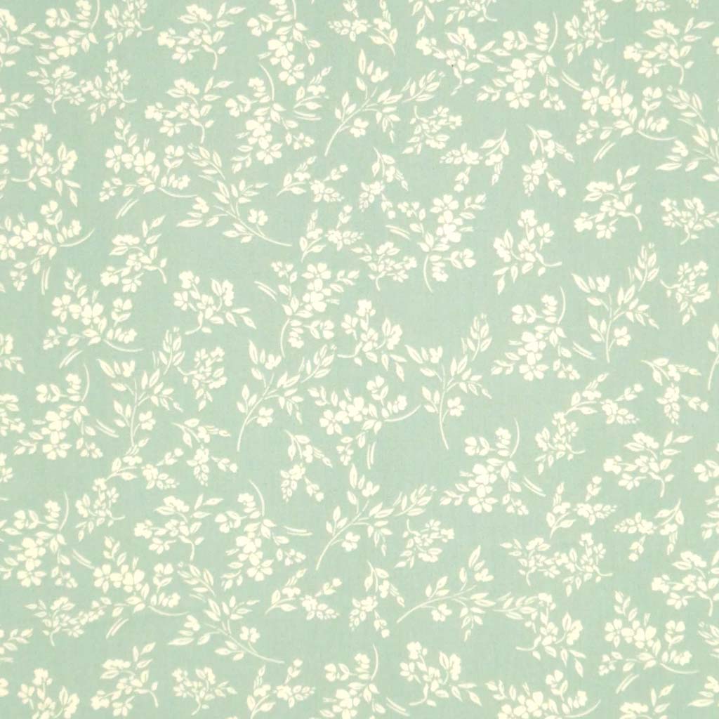 A cream vine floral printed on a sge green cotton poplin fabric by Rose & Hubble