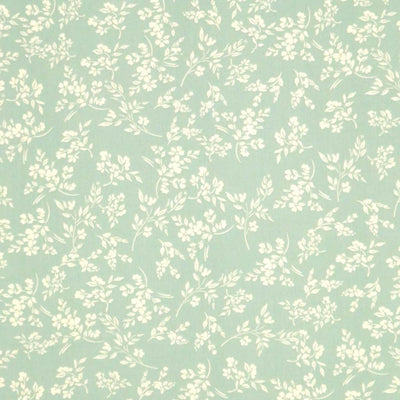 A cream vine floral printed on a sge green cotton poplin fabric by Rose & Hubble