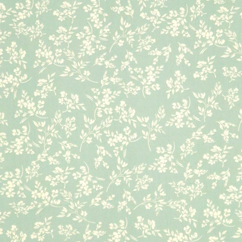 A cream vine floral printed on a sge green cotton poplin fabric by Rose & Hubble