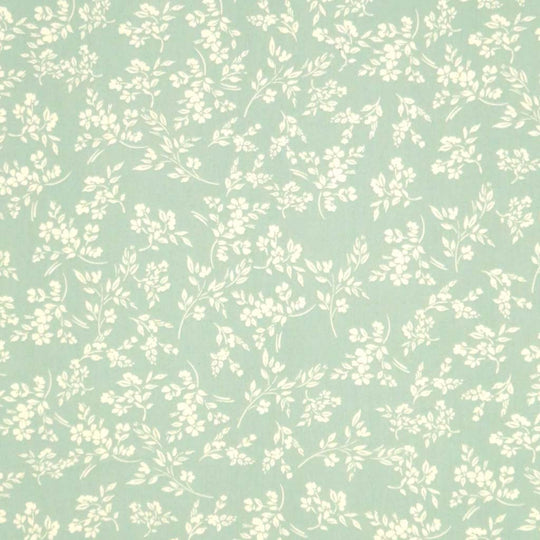 A cream vine floral printed on a sge green cotton poplin fabric by Rose & Hubble