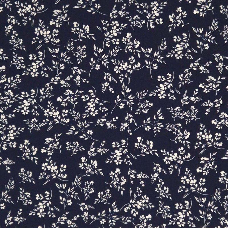 An ivory vine floral printed on a navy cotton poplin fabric by Rose & Hubble