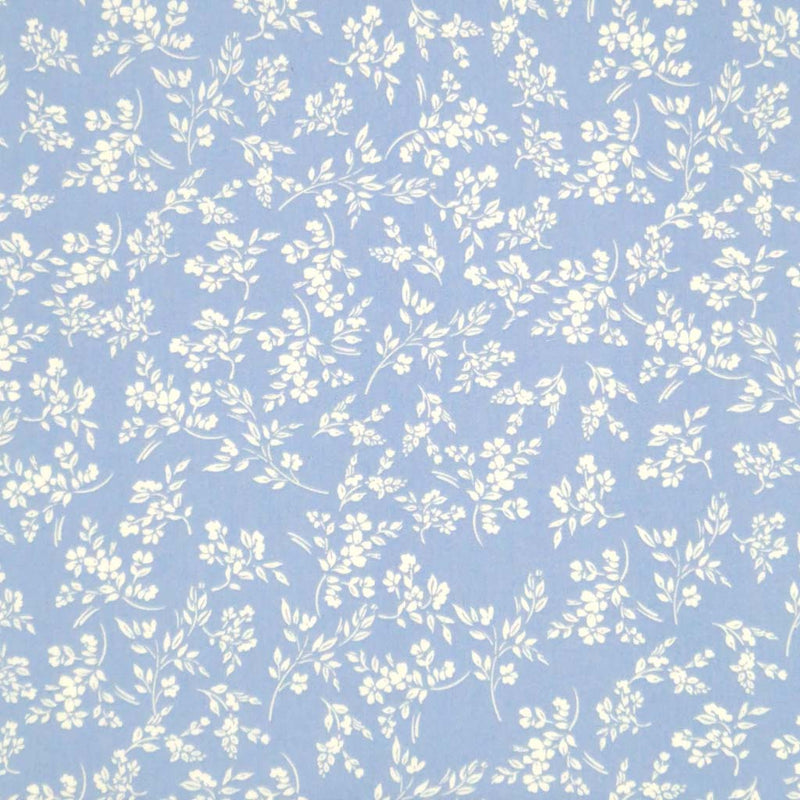 A cream vine floral printed on a sky blue cotton poplin fabric by Rose & Hubble