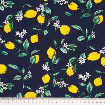 Lemons printed on a navy cotton poplin fabric with a cm ruler