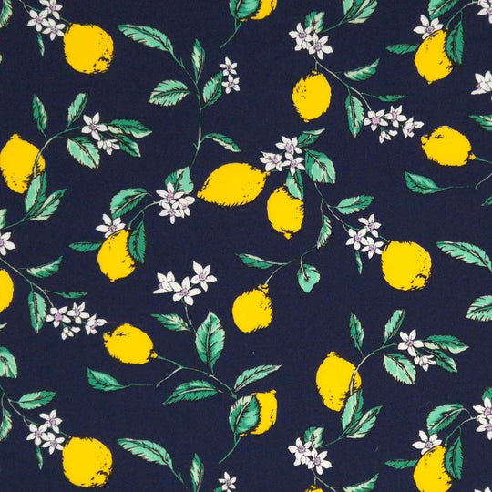 Lemons printed on a navy cotton poplin fabric