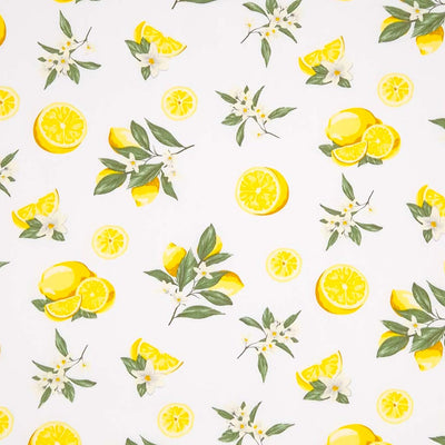 Lemons printed on an ivory coloured cotton poplin fabric