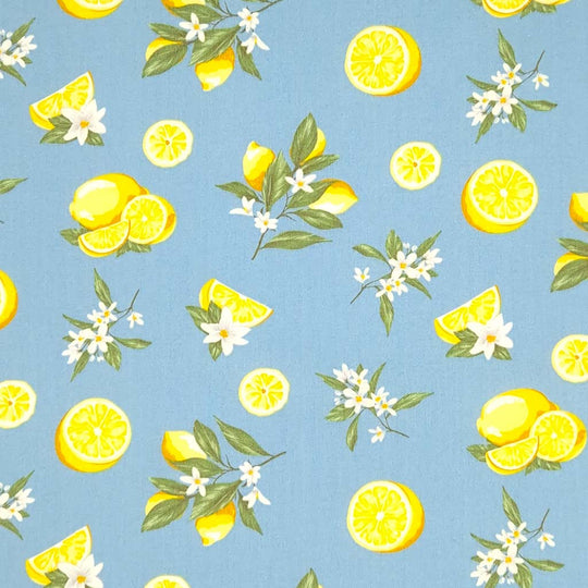 Lemons printed on a denim coloured cotton poplin fabric