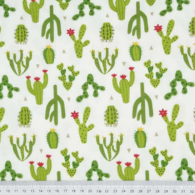 Cacti printed on an off white cotton jersey fabric with a cm ruler