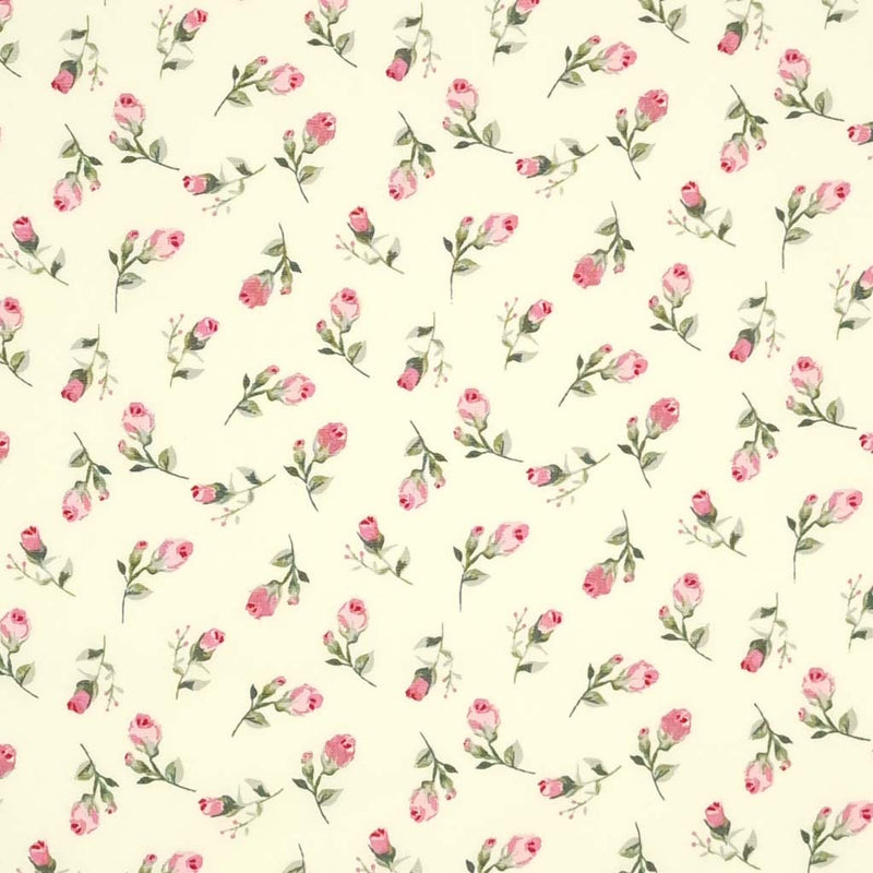 A ditsy pink flower printed on a cream cotton poplin fabric by Rose & Hubble