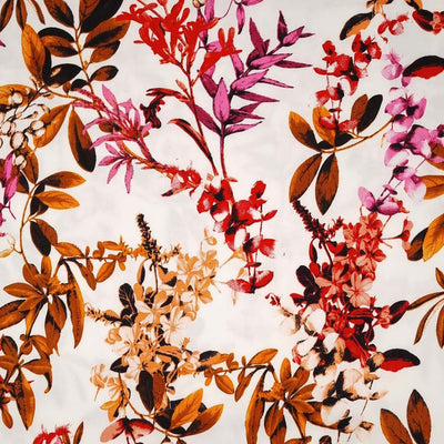 A red floral pattern with golden summer leaves printed on a cotton sateen fabric