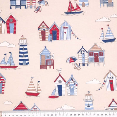 Beach huts printed on a cream half panama fabric with a cm ruler