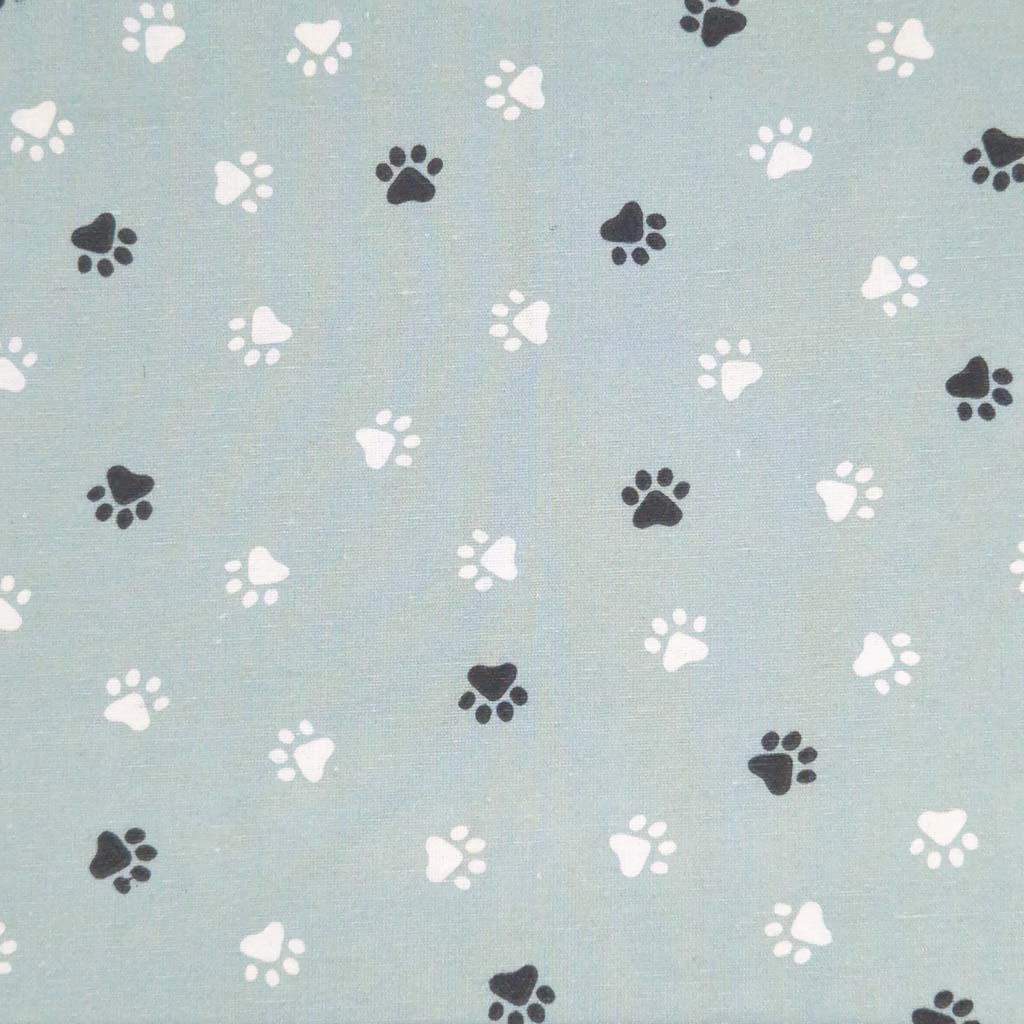 Paw prints printed on a duck egg cotton canvas fabric