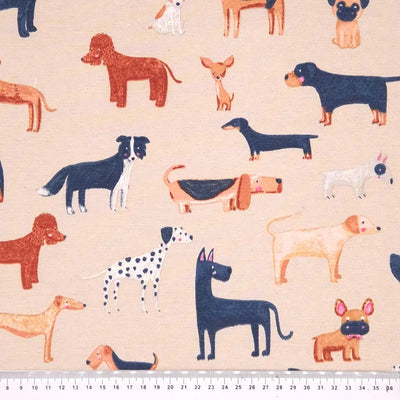 Cute dogs printed on a cream half panama fabric with a cm ruler