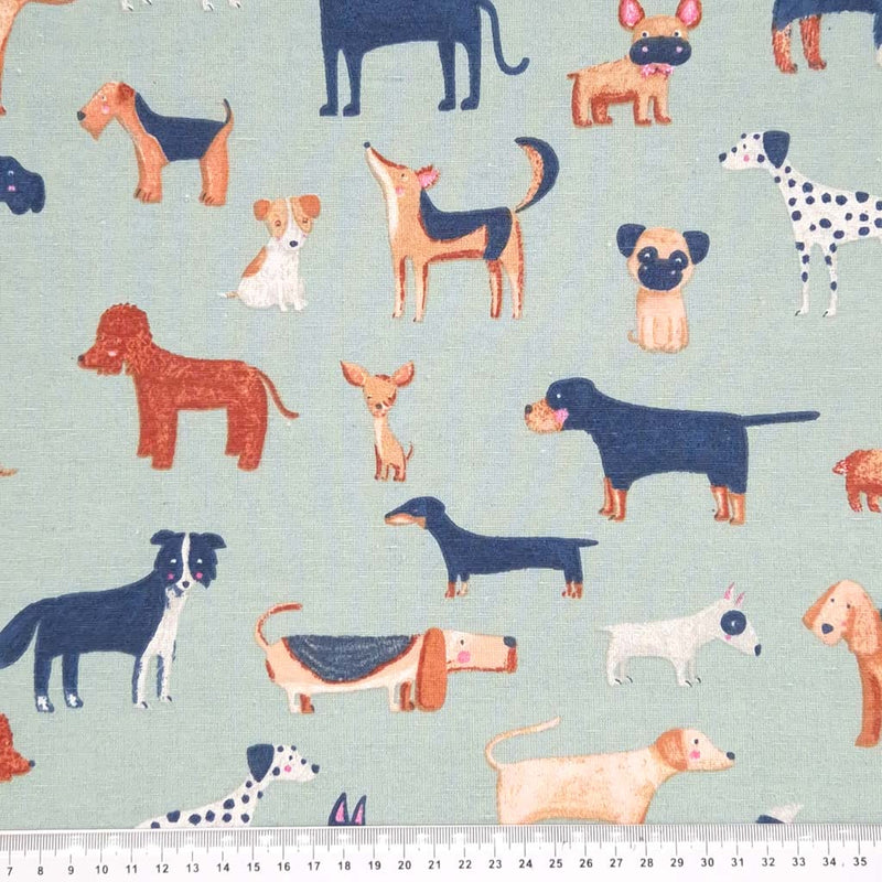 Cute dogs printed on a duck egg half panama fabric with a cm ruler