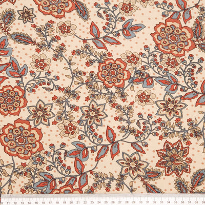 Floral pattern with red, orange, and blue flowers on a beige viscose fabric with a cm ruler