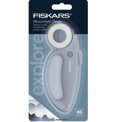 Fiskars rotary cutter in packaging with mountain design