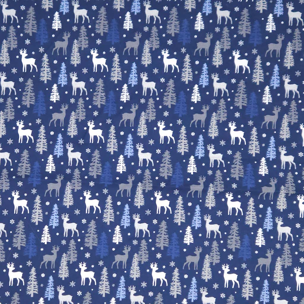 Pattern of deer and trees on a blue christmas cotton fabric