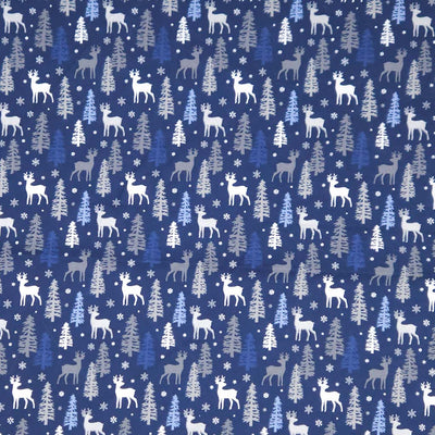 Pattern of deer and trees on a blue christmas cotton fabric