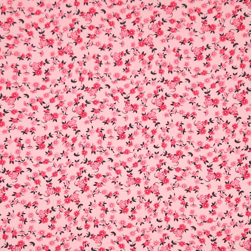 Pink fabric with small floral pattern on a viscose fabric