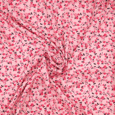 Pink fabric with small floral pattern on a viscose fabric