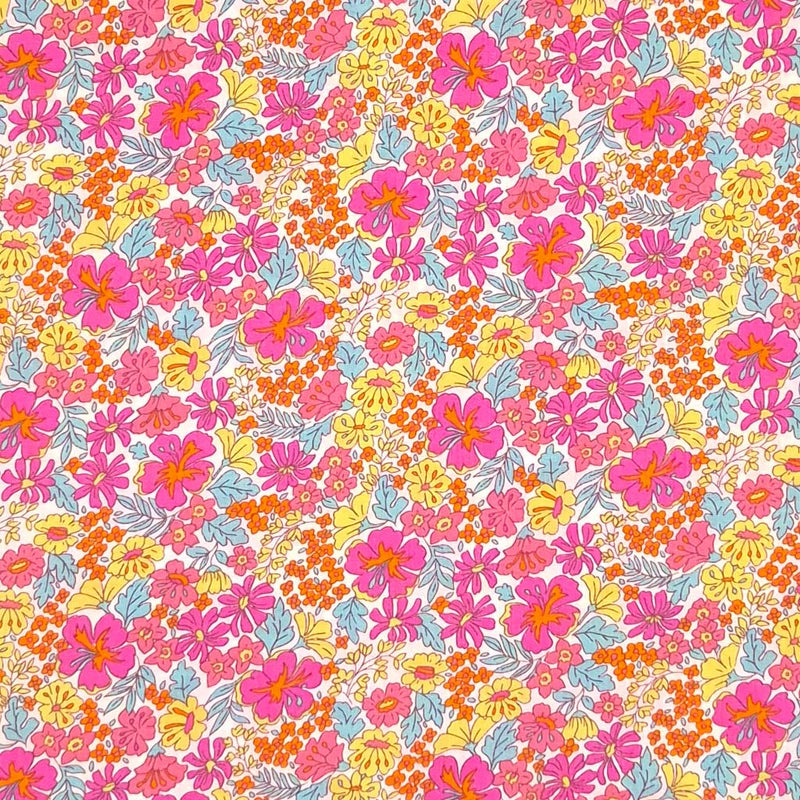 Pink and yellow ditsy flowers are printed on a cotton lawn fabric