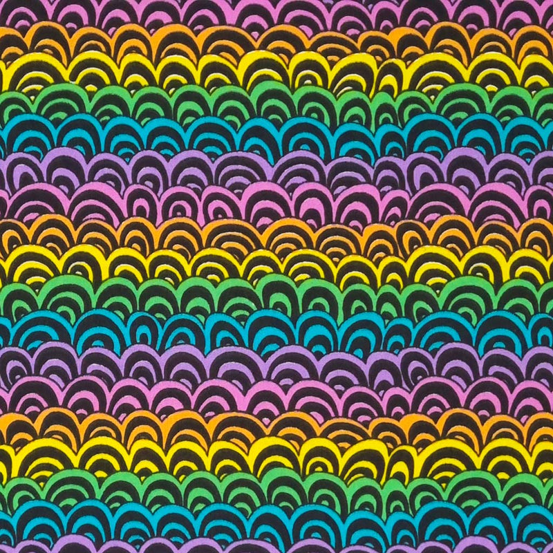 A colourful doodle rainbow print on a black polycotton fabric