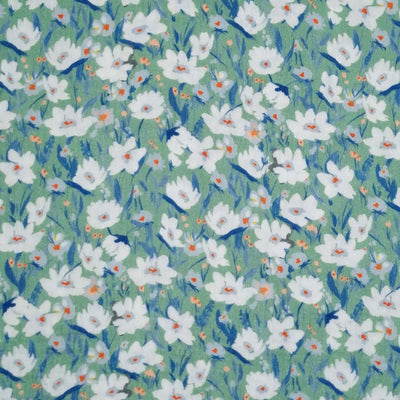Mystical daisies printed on a sage green double gauze fabric