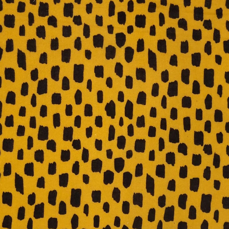 Black blocks printed on a mustard coloured double gauze