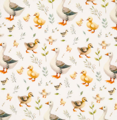 Ducks and ducklings printed on an ivory cotton poplin fabric