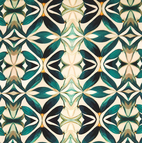 An emerald green mandala pattern printed on a cotton jersey fabric