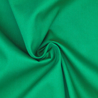 A plain emerald green 100% cotton drill with a swirl