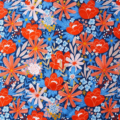 Orange flowers printed with blue foliage on a blue cotton fabric by Little Johnny