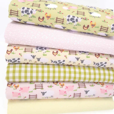 A farmyard themed fat quarter bundle in green, pink and lemon yellow